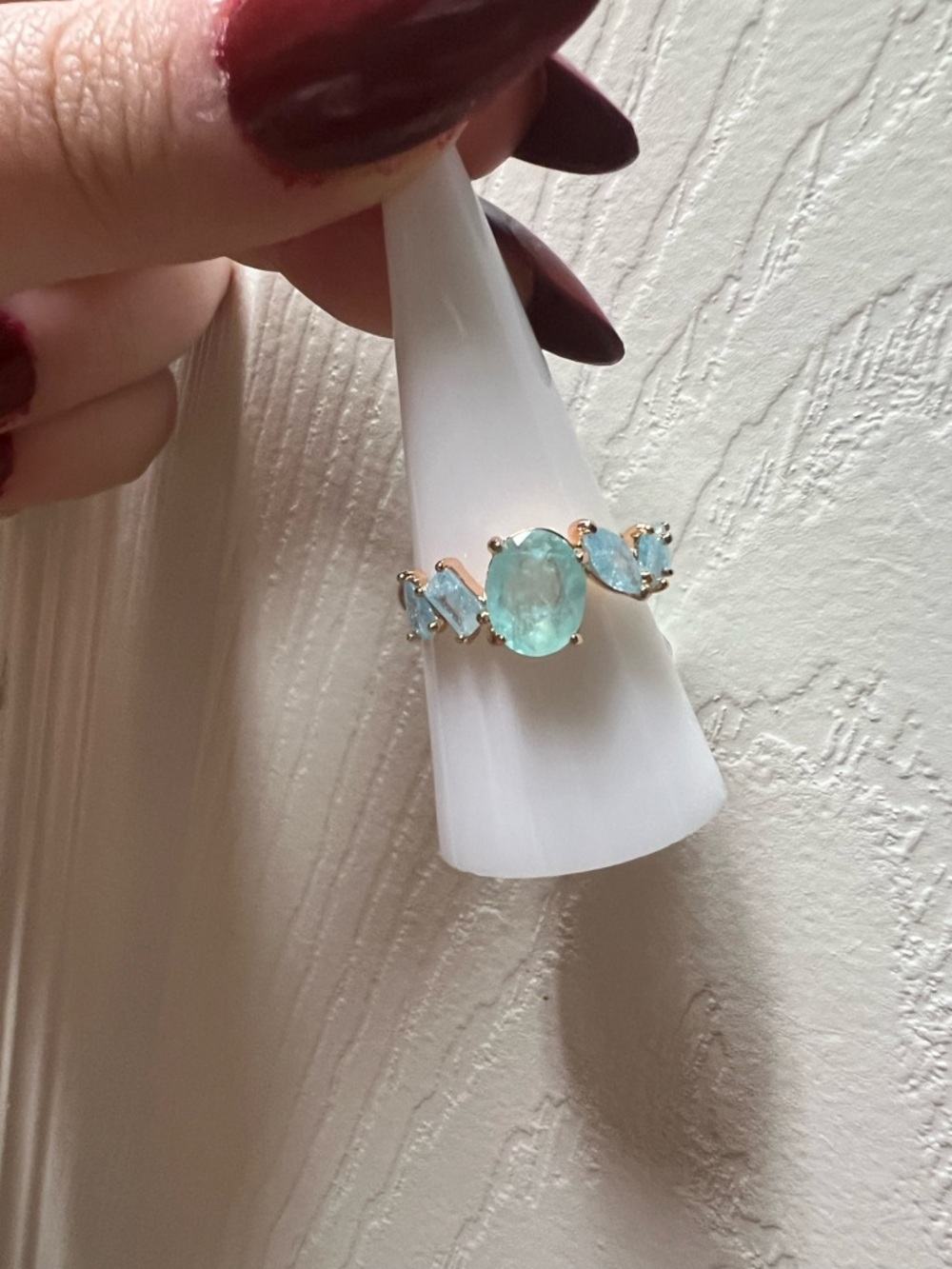 Rose Gold Ring with Aquamarine-Colored Oval Center Stone